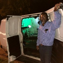 Man Standing Behind the Van Man Standing Behind the Van